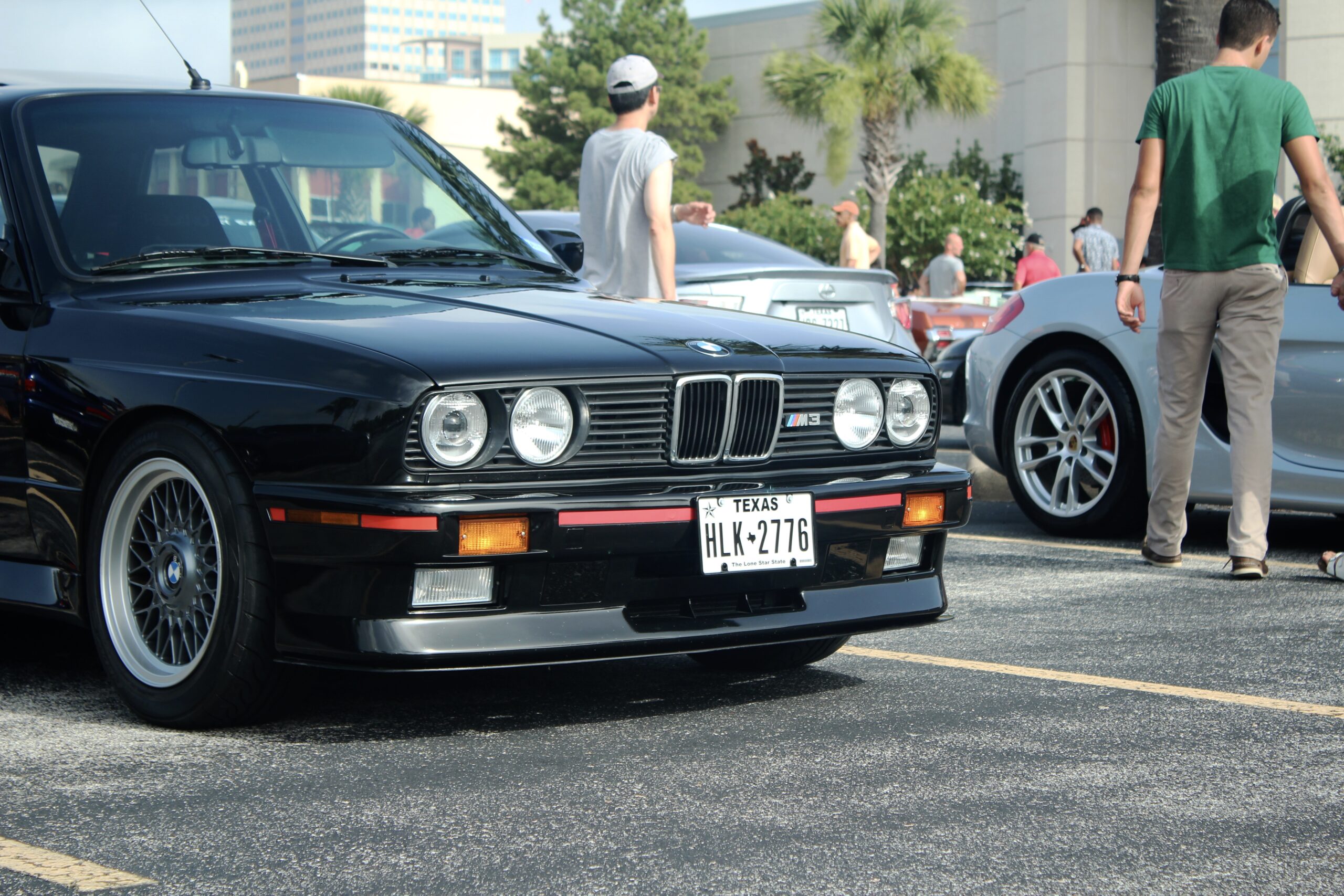 Black BMW M3 in a parking lot at a cars and coffee event